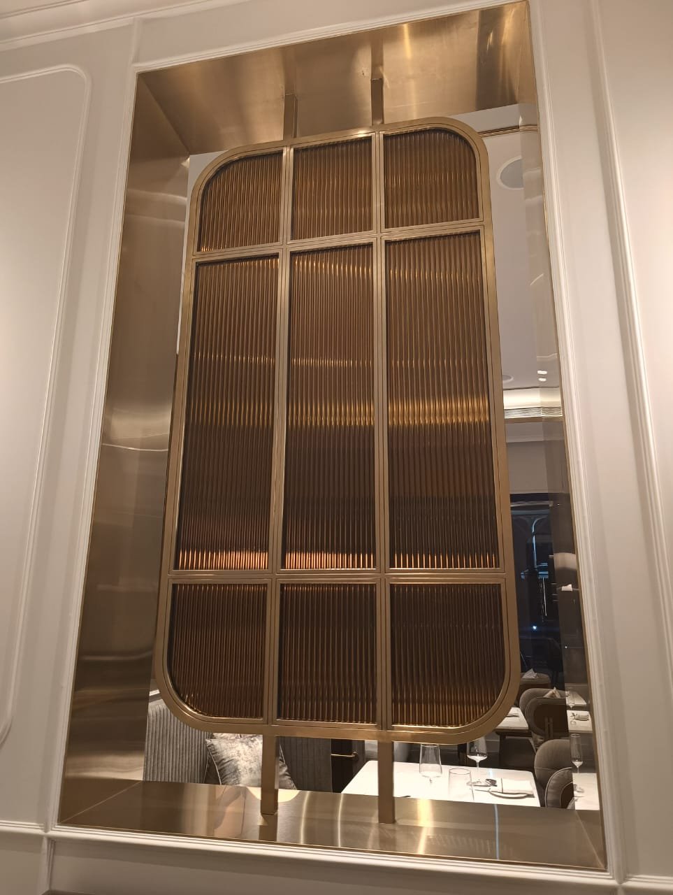 Aanjana Arts reeded bronze panel installation